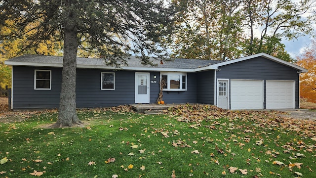 ranch-style house with a garage and a front yard