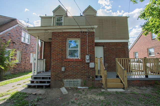 view of front of property featuring a wooden deck