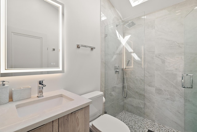 full bath with toilet, a shower stall, and vanity