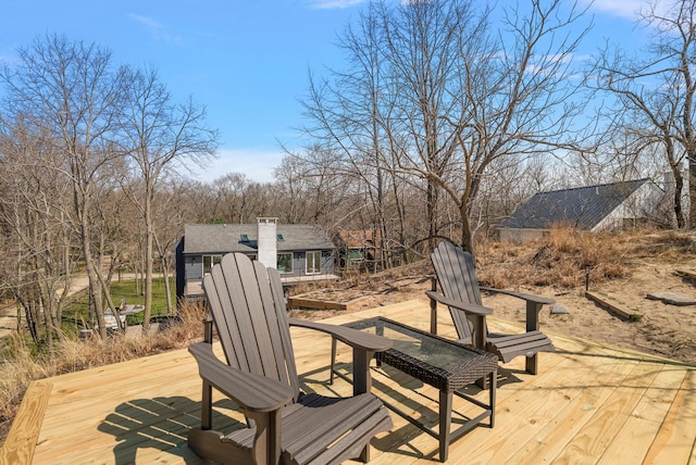 wooden deck with an outbuilding