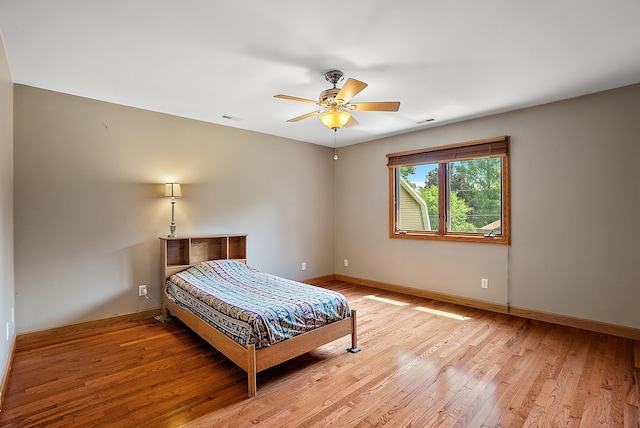 bedroom featuring light hardwood / wood-style flooring and ceiling fan