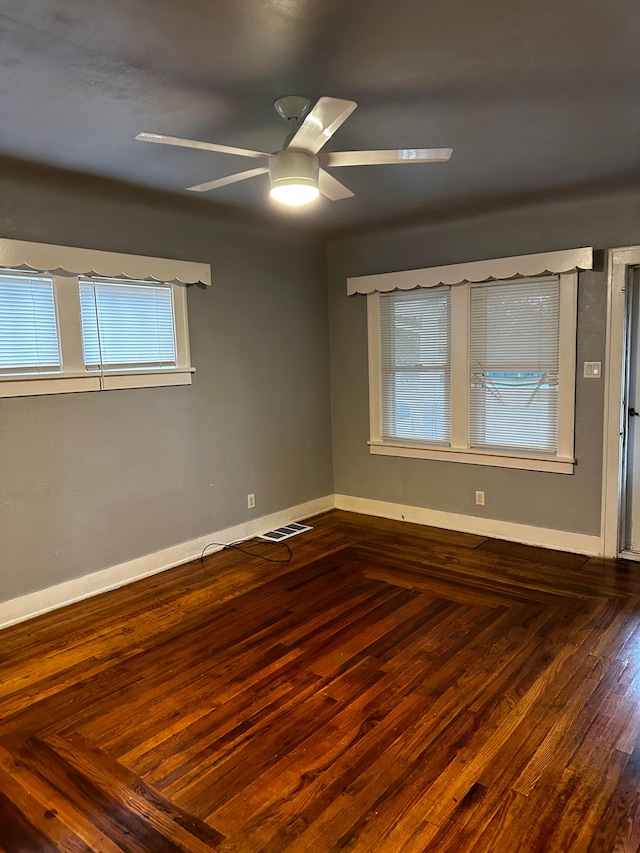 empty room featuring hardwood / wood-style floors and ceiling fan