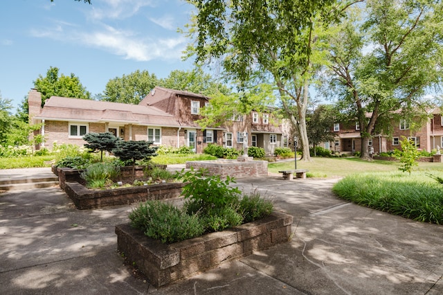 view of property's community with a yard