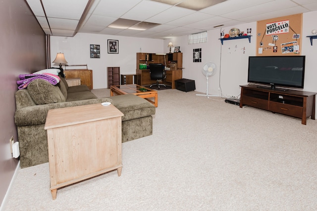 living room with carpet floors and a drop ceiling