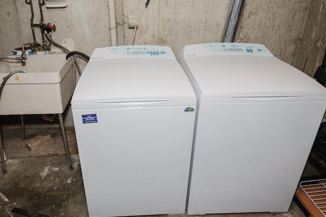 laundry area featuring sink and washer and dryer