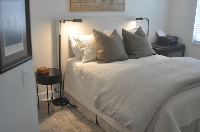 bedroom with hardwood / wood-style floors