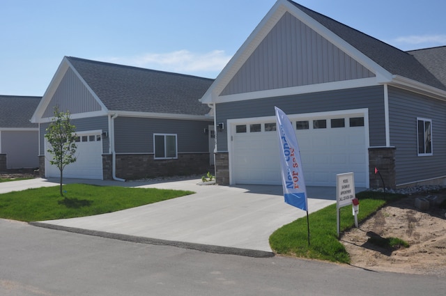 craftsman inspired home with a garage