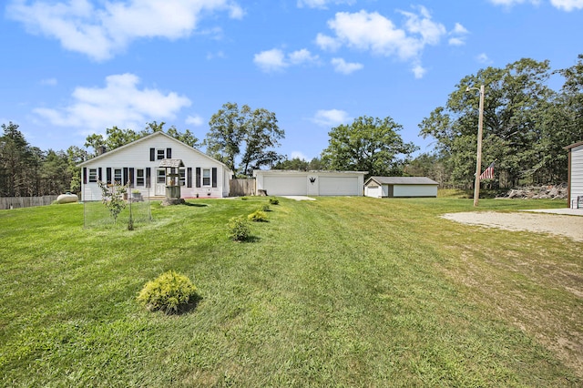 view of yard featuring an outbuilding and a garage