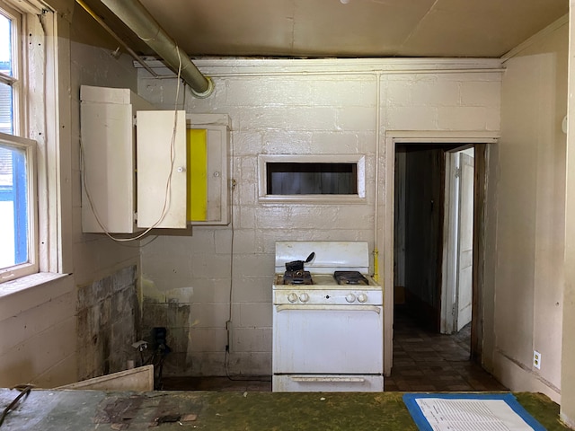 kitchen with white gas range oven