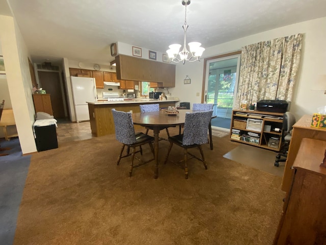 carpeted dining room featuring a notable chandelier