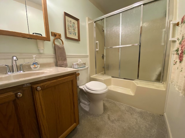 full bathroom with vanity, toilet, and bath / shower combo with glass door