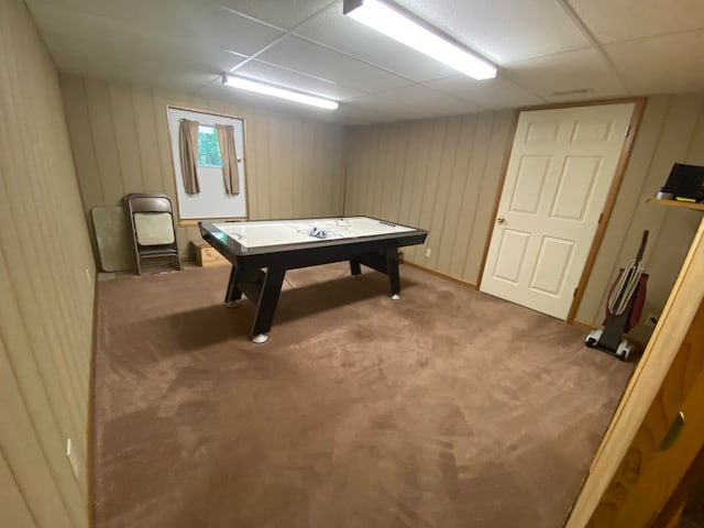 playroom with carpet flooring and a drop ceiling