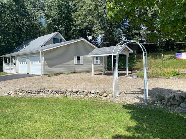 exterior space featuring a yard and a garage