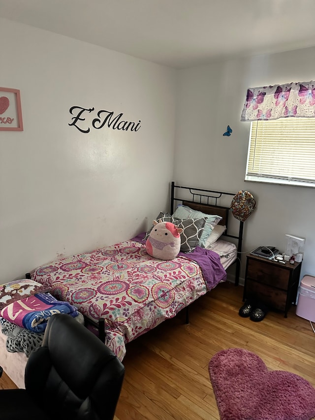 bedroom with light hardwood / wood-style floors