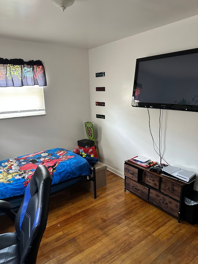 bedroom with wood-type flooring