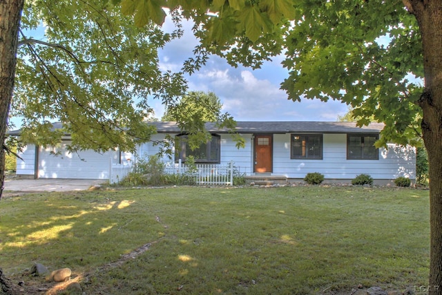 ranch-style house with a garage and a front yard