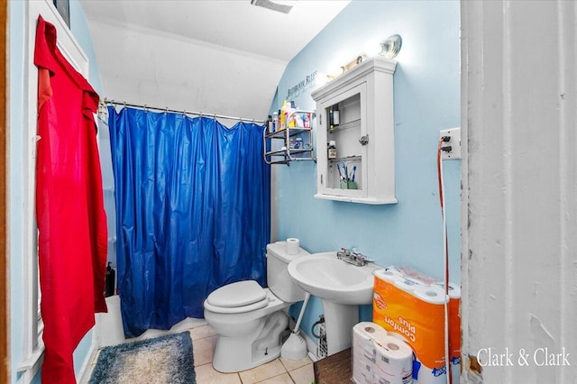 1632 Kalamazoo Ave SE, Grand Rapids, MI 49507 - bathroom with toilet, tile patterned floors, lofted ceiling, and shower / bathtub combination with curtain