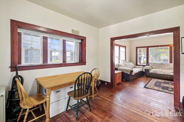 dining space featuring dark hardwood / wood-style flooring