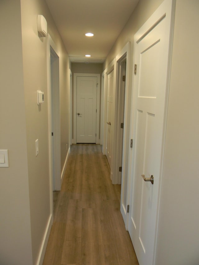 hallway featuring hardwood / wood-style flooring