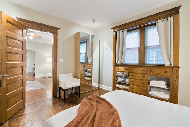 bedroom with dark wood-type flooring