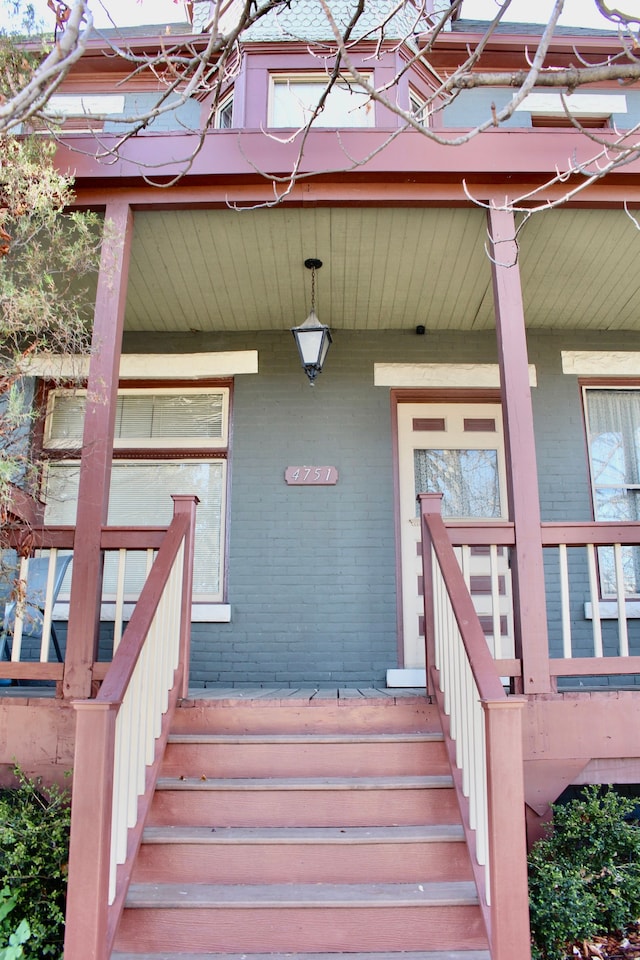 doorway to property featuring a porch