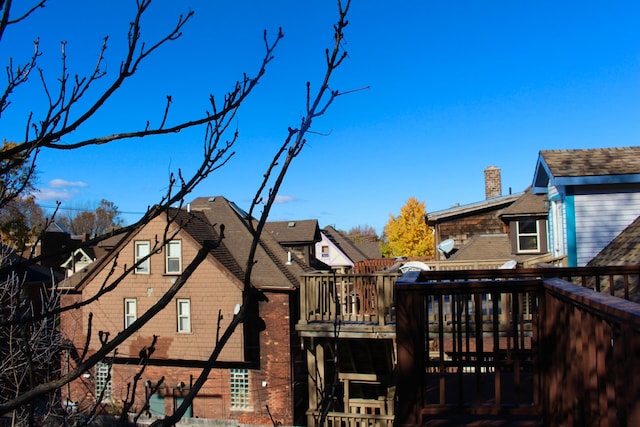 view of side of home with a deck