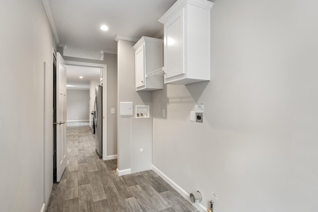 laundry room featuring hookup for an electric dryer, hookup for a washing machine, ornamental molding, gas dryer hookup, and hardwood / wood-style floors