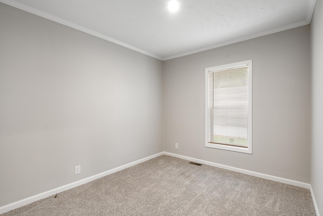 carpeted spare room with ornamental molding