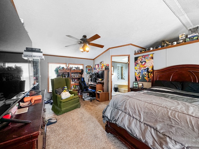 carpeted bedroom featuring ceiling fan, ensuite bathroom, a textured ceiling, vaulted ceiling, and ornamental molding