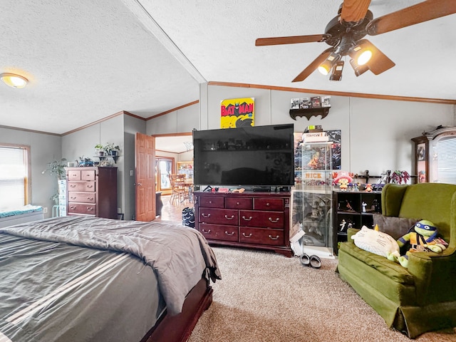 carpeted bedroom featuring a textured ceiling, vaulted ceiling, ceiling fan, and crown molding