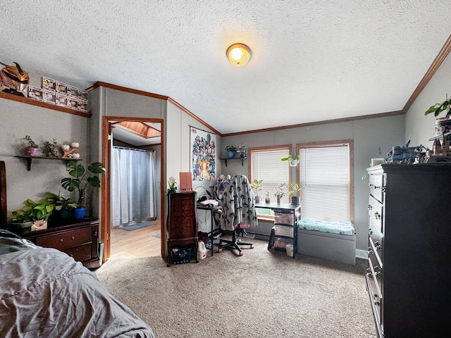 carpeted bedroom with ornamental molding, a textured ceiling, and vaulted ceiling