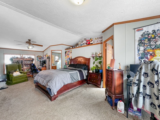 carpeted bedroom featuring a textured ceiling, vaulted ceiling, ceiling fan, and ornamental molding