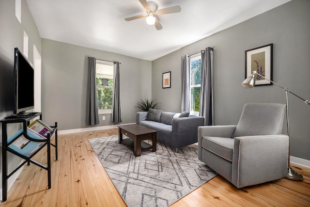 living room featuring ceiling fan, a healthy amount of sunlight, and light hardwood / wood-style floors