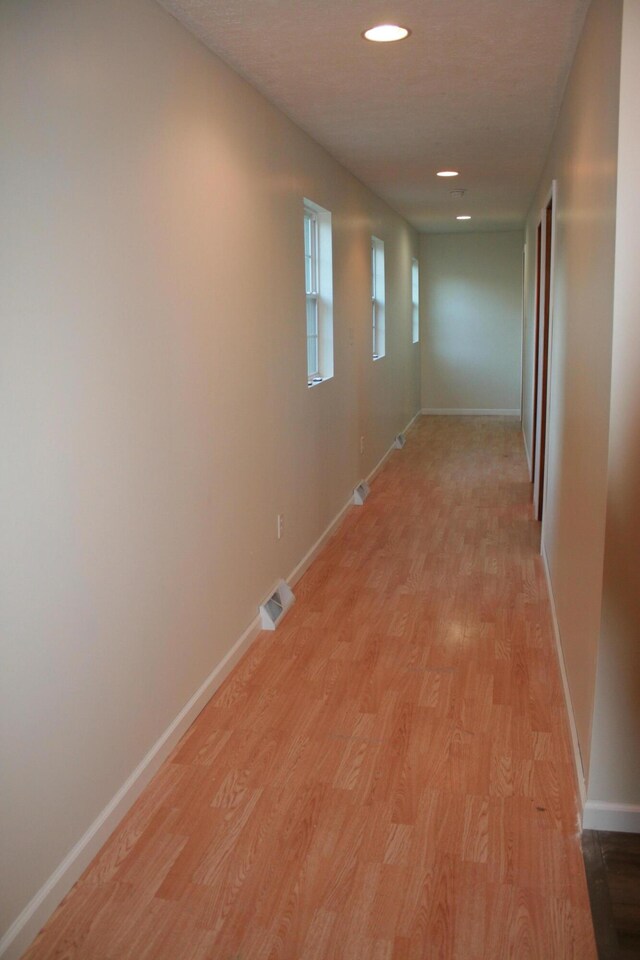 2960 W John Beers Rd, Stevensville, MI 49127 - hallway with light wood-type flooring, baseboards, and recessed lighting