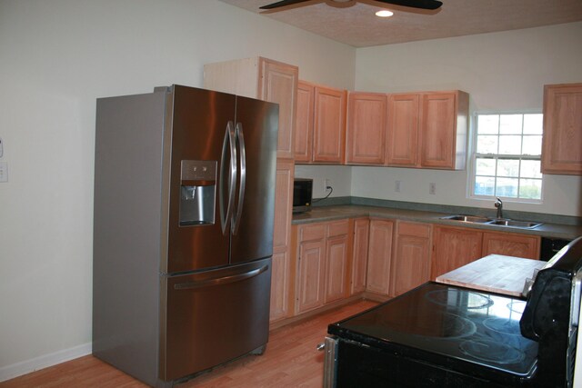 2960 W John Beers Rd, Stevensville, MI 49127 - kitchen with stainless steel appliances, a sink, light wood finished floors, light brown cabinetry, and recessed lighting
