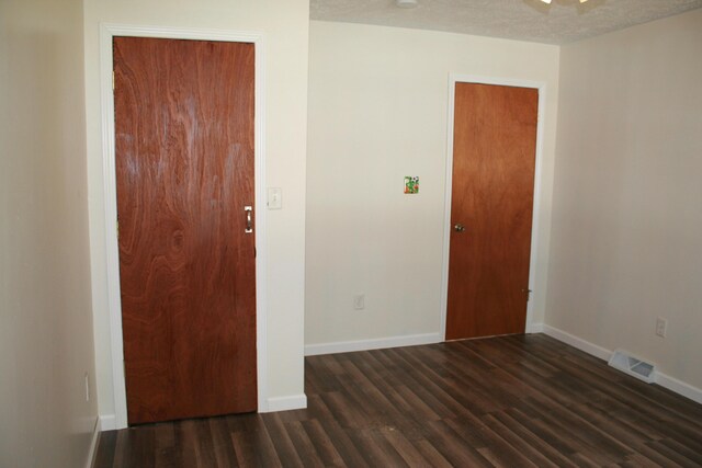 2960 W John Beers Rd, Stevensville, MI 49127 - unfurnished room with dark wood-style floors and baseboards