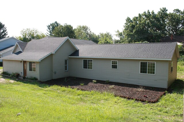 2960 W John Beers Rd, Stevensville, MI 49127 - view of property exterior with a lawn and roof with shingles