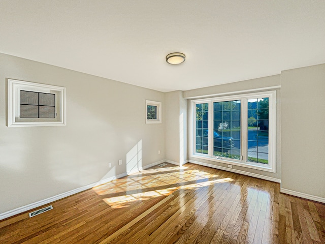 spare room with light wood-type flooring