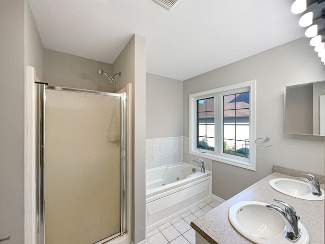 bathroom with tile patterned floors, vanity, and plus walk in shower