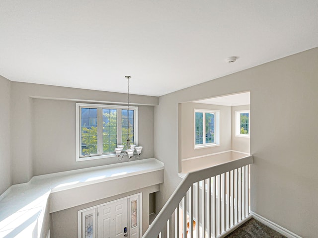 hallway featuring a wealth of natural light