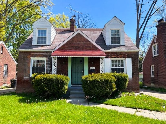 new england style home with a front yard