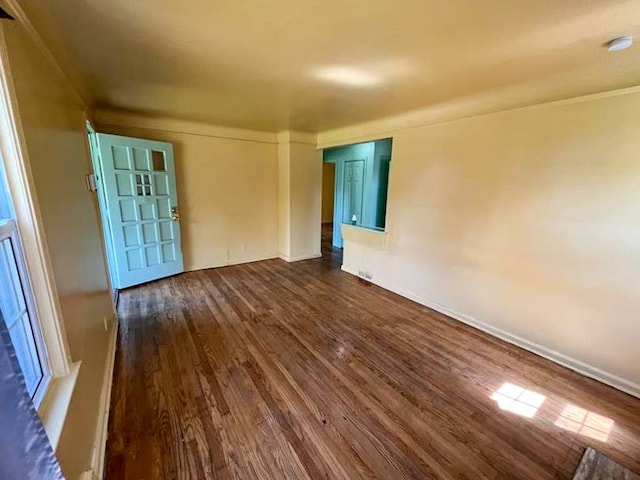 empty room featuring dark wood-type flooring