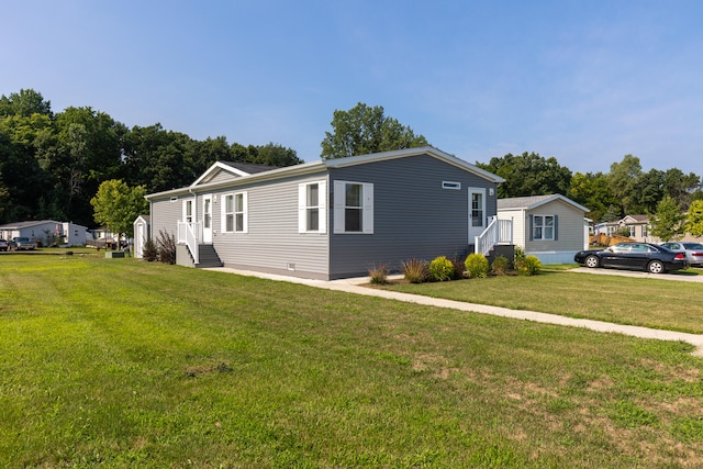 view of front of property with a front lawn