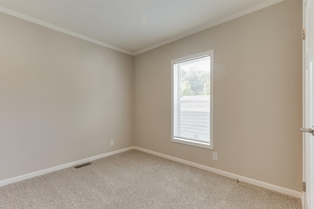 carpeted spare room with ornamental molding