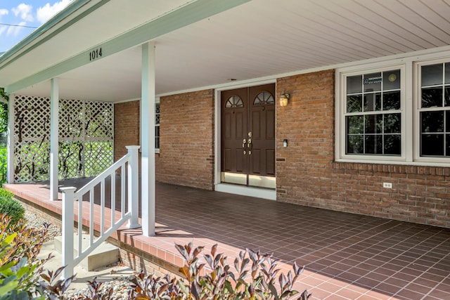 doorway to property with a porch