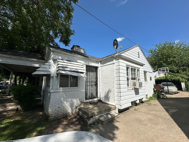 view of front of house featuring cooling unit