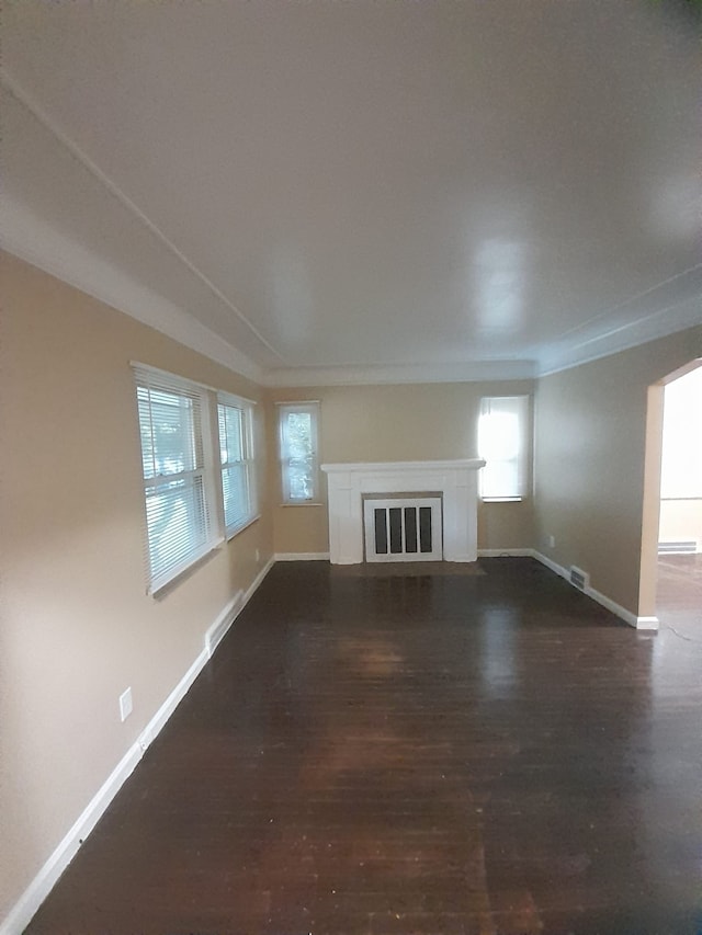 unfurnished living room with dark hardwood / wood-style floors