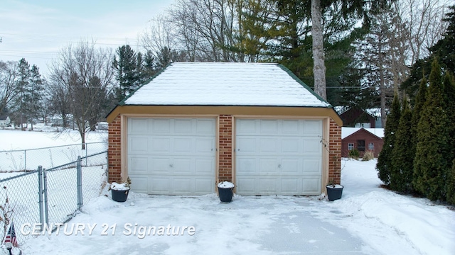 view of snow covered garage