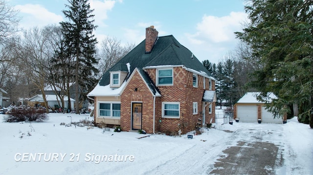 view of front of home featuring a garage and an outdoor structure