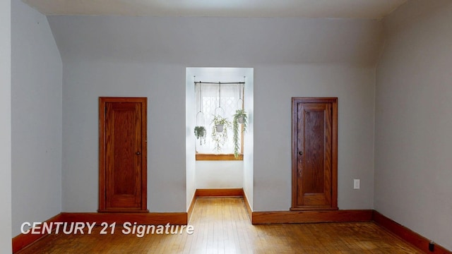 unfurnished room with wood-type flooring